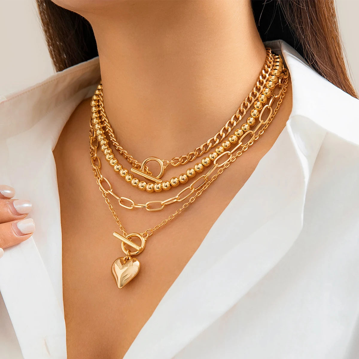 Golden Heart Elegance – A 4-Piece Y2K Necklace Set for Bold and Modern Women