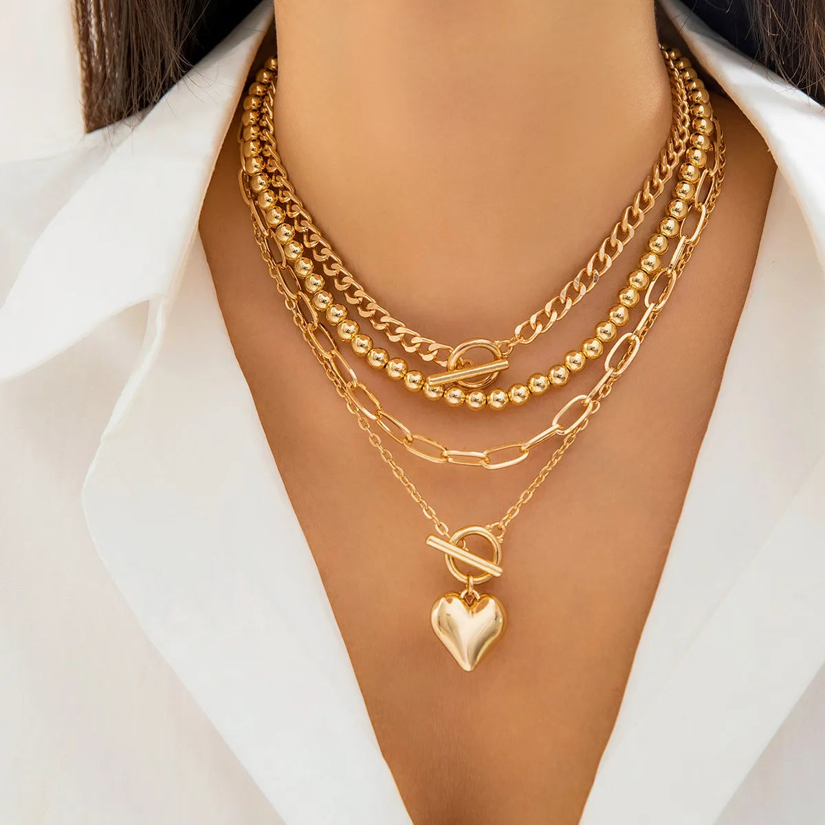 Golden Heart Elegance – A 4-Piece Y2K Necklace Set for Bold and Modern Women