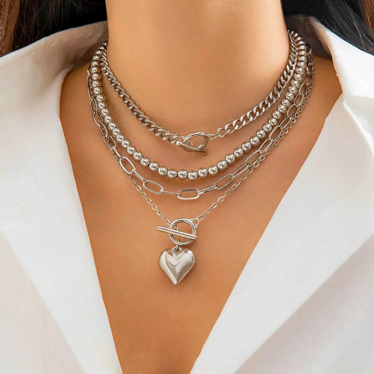 Golden Heart Elegance – A 4-Piece Y2K Necklace Set for Bold and Modern Women