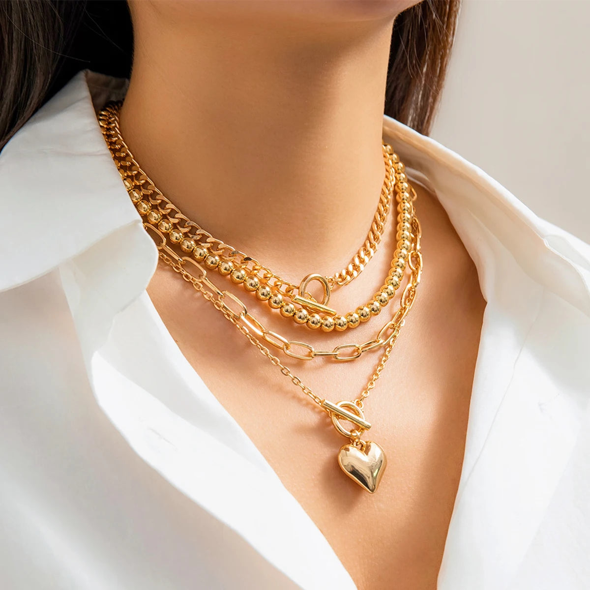 Golden Heart Elegance – A 4-Piece Y2K Necklace Set for Bold and Modern Women