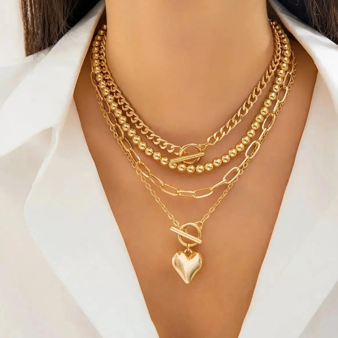 Golden Heart Elegance – A 4-Piece Y2K Necklace Set for Bold and Modern Women