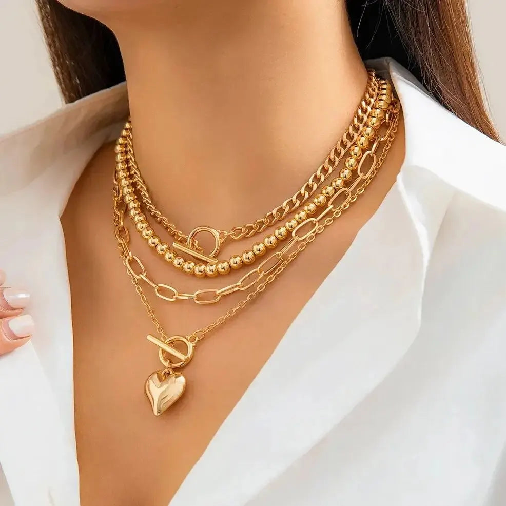 Golden Heart Elegance – A 4-Piece Y2K Necklace Set for Bold and Modern Women